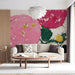 Modern living room featuring a vibrant circular brushstroke feature wall behind a minimalist grey sofa.