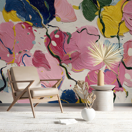 Study interior with colorful abstract painterly floral wallpaper behind a mid-century sofa