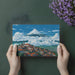 Home office wall mural with a serene mountain and village design to inspire focus