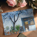 Blue blossom mural decor in a peaceful nursery room with light tones.