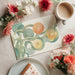 Bright dining room featuring a citrus-inspired mural accent wall