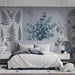 A serene bedroom decorated with a blue monochromatic botanical sketch wallpaper.