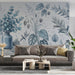A bright, airy home office featuring a botanical blue sketch wall mural behind a minimalist wooden desk.