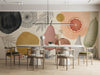 Modern meeting room featuring a botanical fruit mural wallpaper on the main dining wall.