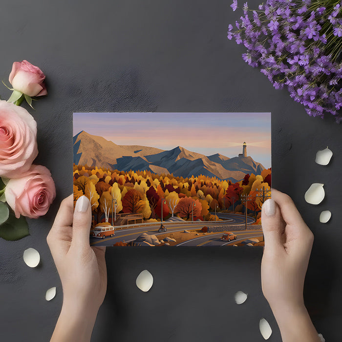 A cozy living room with a mountain landscape wallpaper mural on the main feature wall.