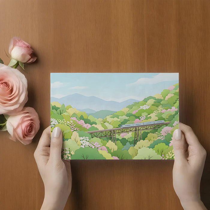 Nature-themed mural featuring a mountain train in a peaceful home office setting