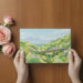 Nature-themed mural featuring a mountain train in a peaceful home office setting