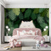 A creative bedroom space decorated with a lush tropical cat mural for a relaxing work environment.