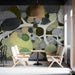 Creative cafe interior showcasing a detailed botanical dot-art mural on a feature wall.