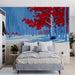 A creative bedroom interior decorated with a striking crimson birch tree landscape mural.