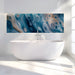 Elegant bathroom with swirling blue fluid art mural wallpaper above a minimalist white sofa.