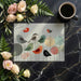 Creative home office space featuring colorful bird and circle wallpaper on a feature wall