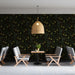 Elegant cafe space with classic olive branch wallpaper and dark wood furniture