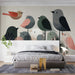 Soft-toned bird illustration mural in a bright, airy dining room