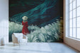 Moody study wall mural with a landscape scene featuring a woman in red and tall grass against teal hills.