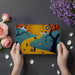 Vibrant artistic landscape mural wallpaper in a creative home office setting
