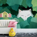 Whimsical cat mural installed behind a modern minimalist bed in a tranquil bedroom setting