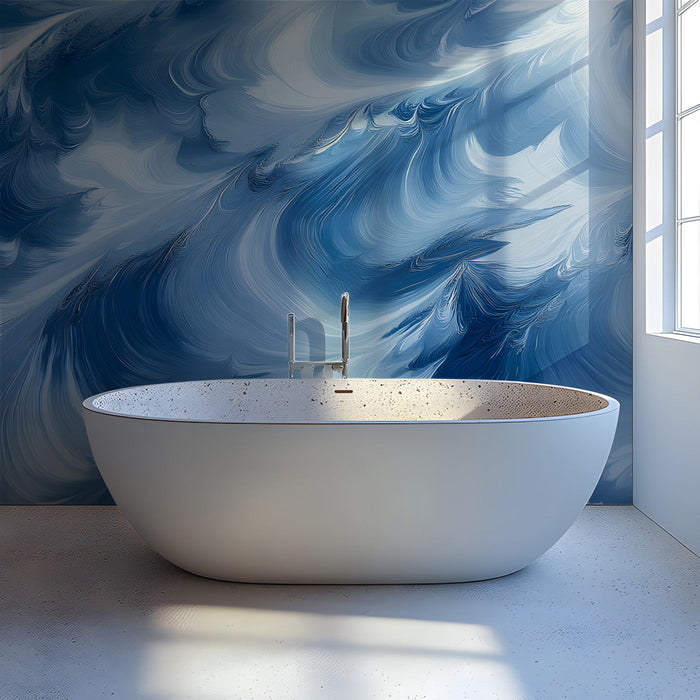 Bathroom featuring blue fluid wave wallpaper behind a neutral gray velvet sofa.