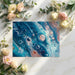 Creative home office wall with vibrant fluid paint swirl wallpaper pattern in blue and orange tones