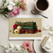 Floral and suitcase wall mural featured in a romantic master bedroom