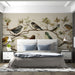 A bright bedroom featuring the avian mural on the main wall behind a wooden headboard.