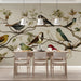 A cozy dining room space with the bird and branch wallpaper creating a calm, natural environment.