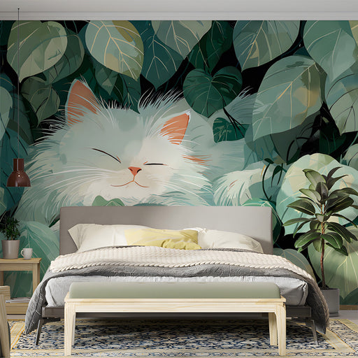 A cozy bedroom with a peaceful cat and green foliage wallpaper behind the bed frame.