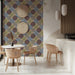 Classic floral geometric wallpaper featuring in a cozy home study room with a library desk.