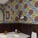 Geometric quatrefoil wallpaper installed on an accent wall in a bright, modern washroom.