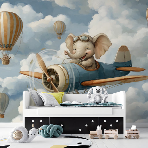 A cozy reading corner in a bedroom with the elephant aviator mural providing a playful and imaginative backdrop.