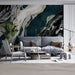 Contemporary living room with a fluid marble wall mural and brass light fixtures
