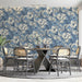 A sophisticated dining room wall covered in vintage floral damask mural in soothing blue tones.