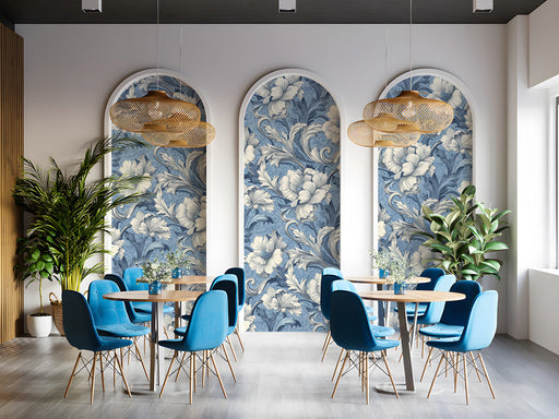 A formal cafe featuring the blue damask floral wallpaper behind a dark wood table.