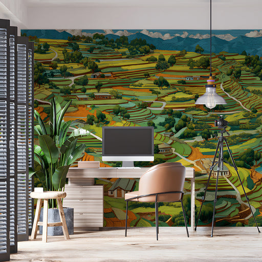 A modern study with a large terraced mountain mural behind a minimalist velvet sofa.