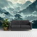A quiet home office space featuring mountain mural wallpaper to provide a tranquil backdrop.