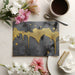 Contemporary home office wall with dramatic black concrete and gold drip wallpaper design