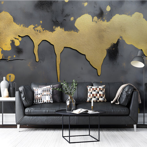 Living room wall featuring charcoal and gold dripping paint mural behind a modern velvet sofa