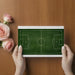 Modern bedroom for a sports enthusiast with a green soccer field wall mural
