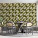 A cozy mid-century modern dining room featuring the olive clover pattern as a focal feature wall.