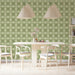 Soft sage green clover pattern in a cozy, modern dining room setting.
