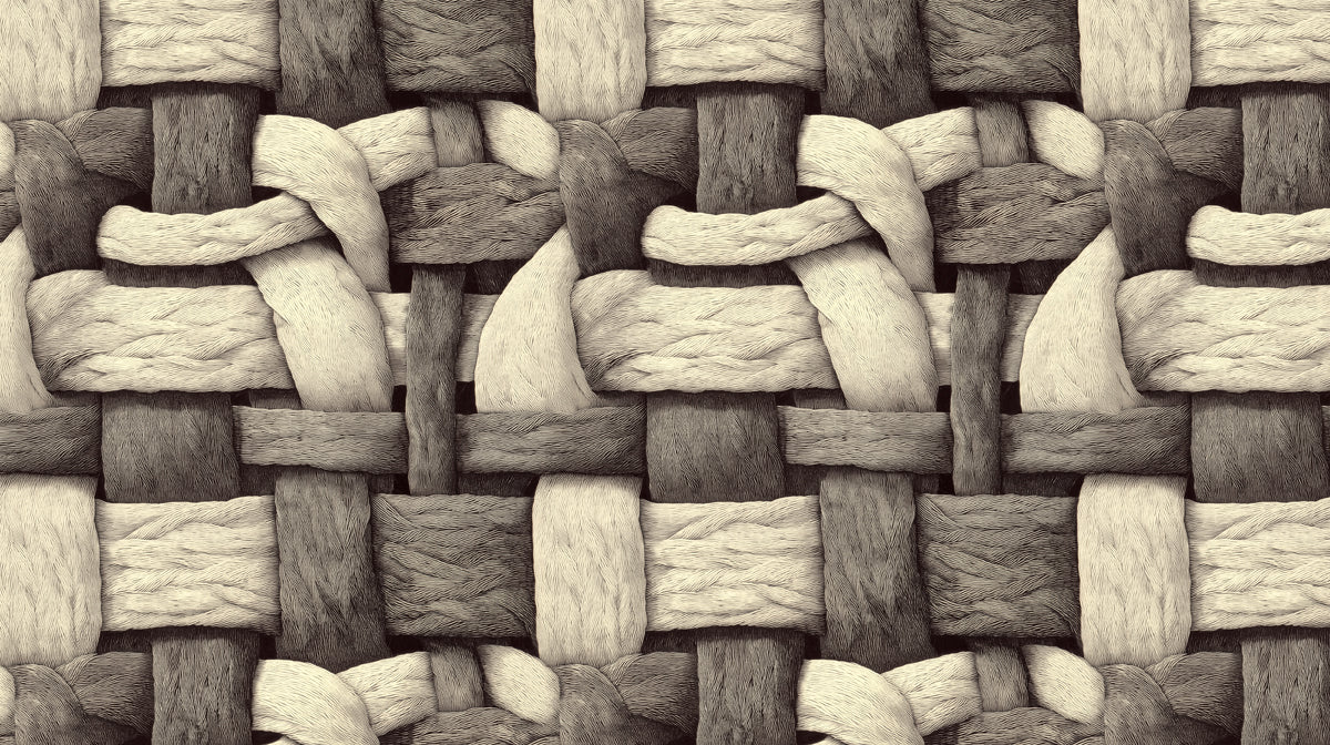 Close up of an oversized woven textile pattern in charcoal, gray, and cream tones.