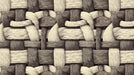 Close up of an oversized woven textile pattern in charcoal, gray, and cream tones.