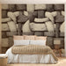 Modern home office with a textured woven mural pattern behind a wooden desk.