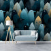 A cozy reading nook featuring the bird and leaf mural on a feature wall behind a velvet armchair.