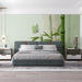 A minimalist bedroom space featuring the bamboo nature mural on a wall with a light wood desk.
