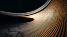 Abstract wallpaper pattern featuring sweeping golden ochre and charcoal black lines in a curved architectural motion
