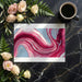 A stylish home office with a dramatic liquid marble wallpaper providing a creative backdrop for a desk setup.