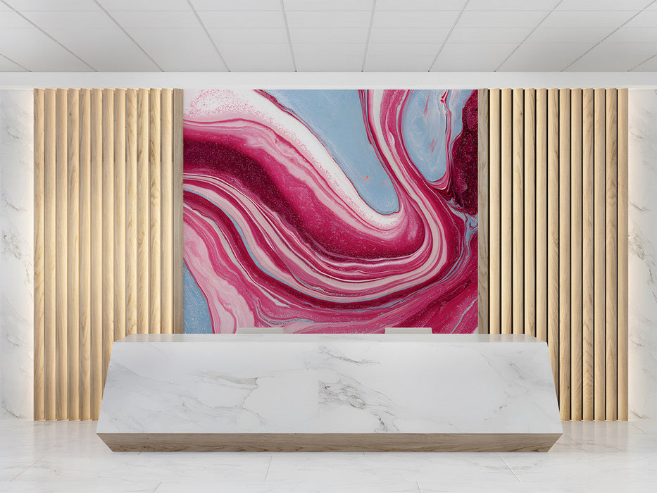 A contemporary reception featuring a bold marble swirl mural on the main accent wall behind a velvet sofa.