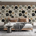 Scandinavian floral wallpaper styled behind a modern beige sofa in a bedroom