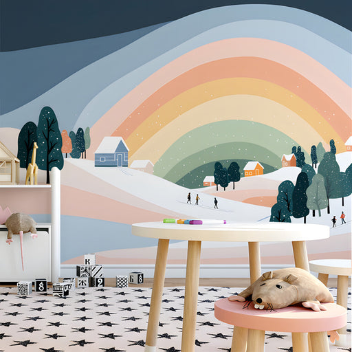 A cozy nursery featuring a snowy landscape mural behind a white wooden crib and soft blush textiles.